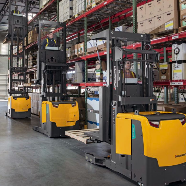 3 jungheinrich narrow aisle forklifts in aisle