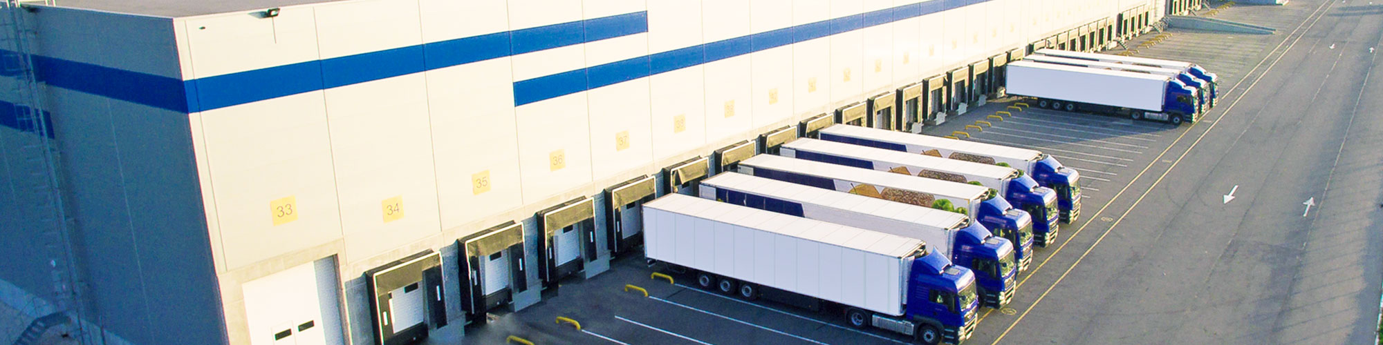 Trucks backed up to loading dock