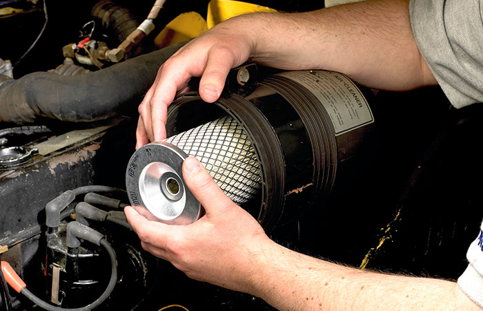 technician replacing promatch forklift filter